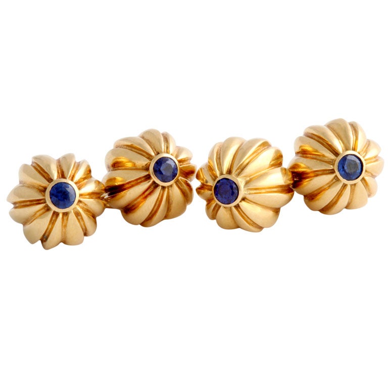 These fluted melon shaped cuff-links, each centering a collet-set sapphire, are elegant, refined, and very stylish - a great pair of Cartier cuff-links, correct for any occasion.