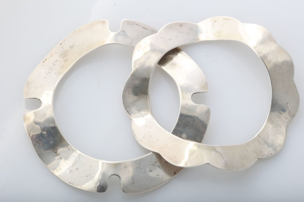 Highly unusual hand hammered & cut out Silver cuffs.  Three dimensional in silhouette.  No marks, but unique. Priced for the Pair.