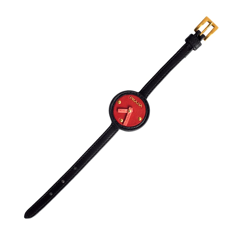 Whimsical leather fashion watch by Prada. Very, very chic.  Since it is non-functional as a watch, perhaps when worn time will stand still.  Included is original Prada box.

Size flexibility--will comfortably fit a small to medium wrist 