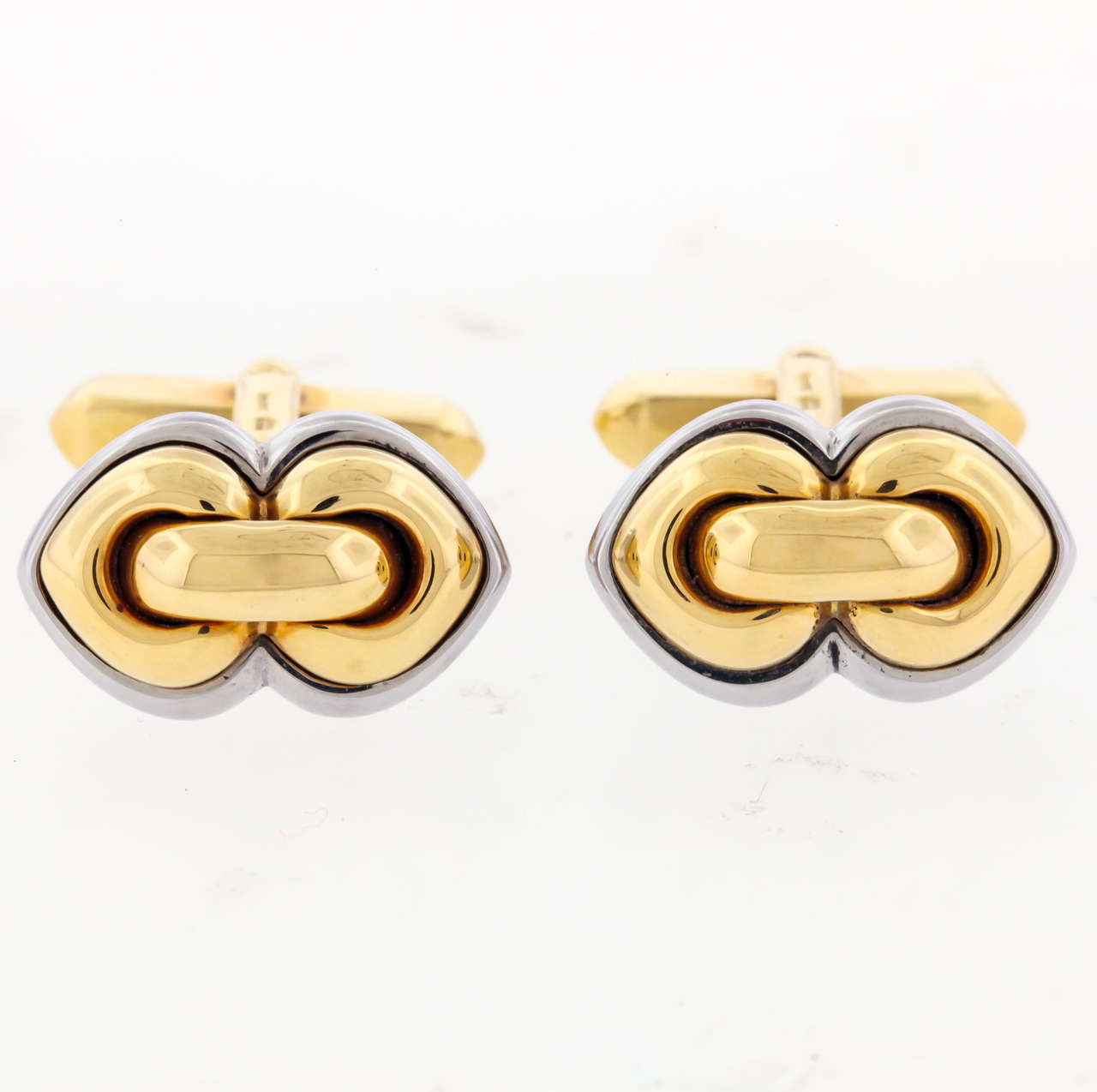 18K yellow and white gold Bvlgari cufflinks in a knotted motif measure 5/8