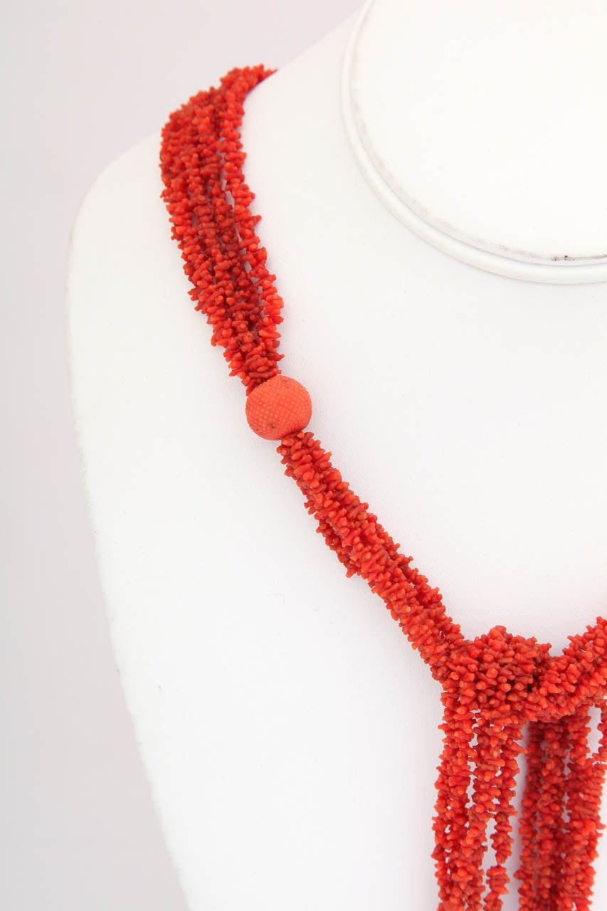 Each bit of Georgian coral in this lariat has been carved and polished by hand and is buttery soft to the touch, making it a breed apart from new coral. It feels precious. There are no rough edges. The tips of each bit of coral are rounded rather