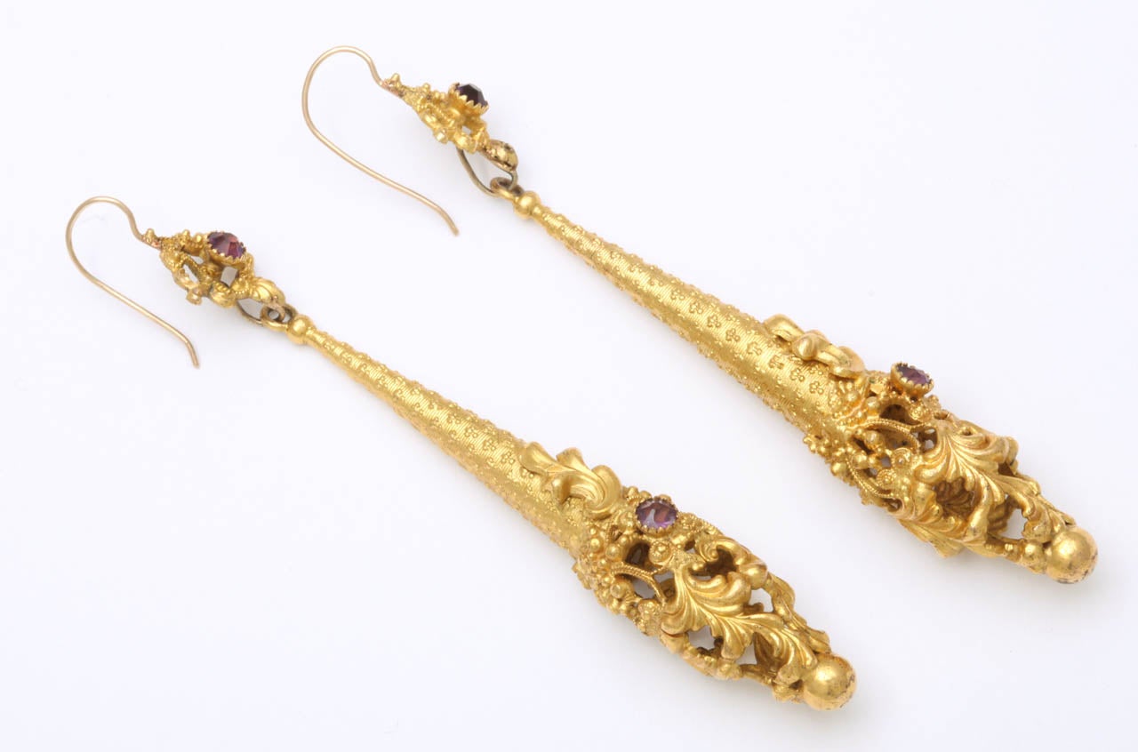 A magnificent example of history, these long beautifully granulated chandelier earrings are set with amethysts from early c. 1790 and were made in the United Kingdom. They are light on the ear and completely original other than the shepherd hooks