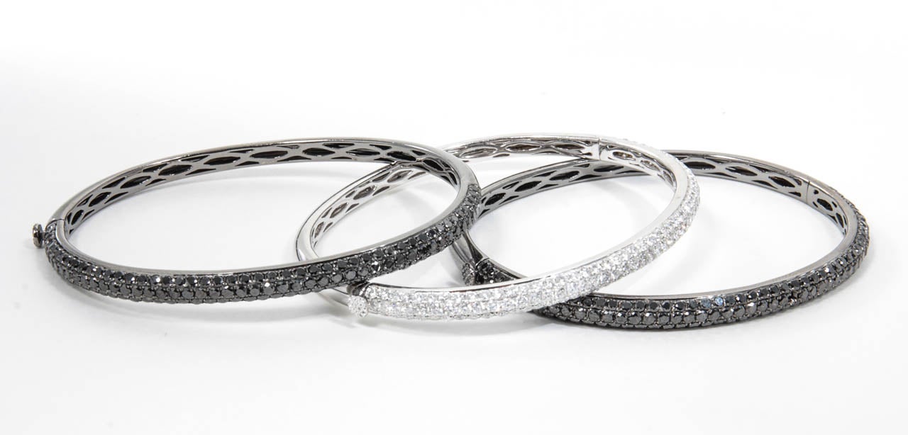 A fashionable set of bangles. Perfect for mixing and matching.

Over 10 carats of diamonds set in 18k white and black gold.
