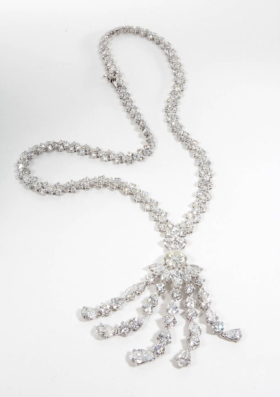 A gorgeous and unique necklace with beautiful movement. 

A large and impressive tassel made up of larger diamonds hanging from a diamond chain.

43 carats of diamonds set in platinum.