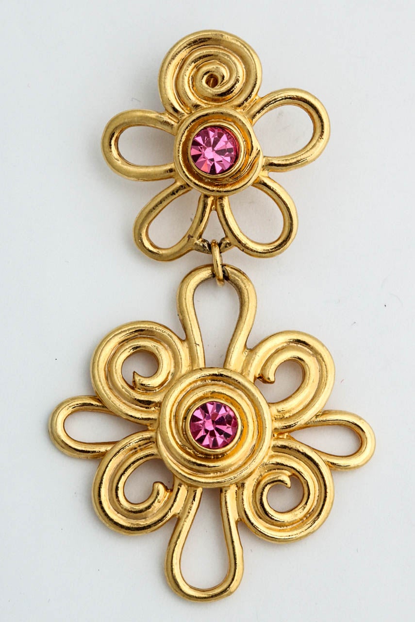 Double daisy gilt clip on earrings with pink rhinestones.