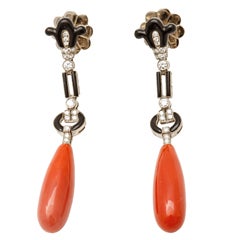 A pair of white gold onyx, coral and diamond pendent earrings