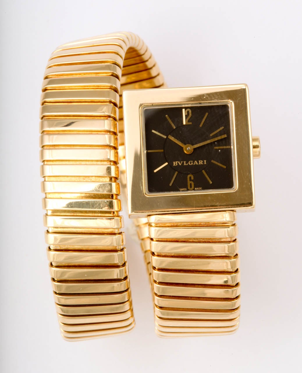 Bulgari 18k yellow gold Tubogas Serpenti bracelet watch featuring one snake wrap and a square dial.