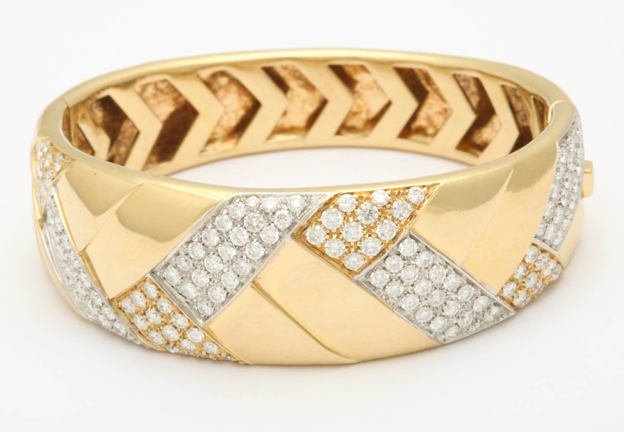 18kt Yellow Gold basketweave   hinged Bangle Cuff bracelet consisting Of 6 Carats of Russian cut super high quality full cut diamonds and open work chevron shape workmanship on inside of bracelet circa 1980's