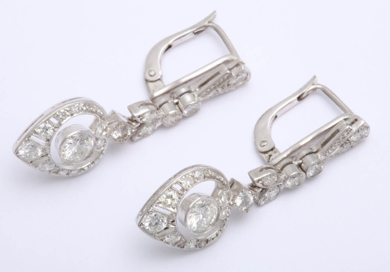 Platinum And old European cut diamonds earrings in shape of heart dangle drops very high quality and beautiful handmade open workmanship