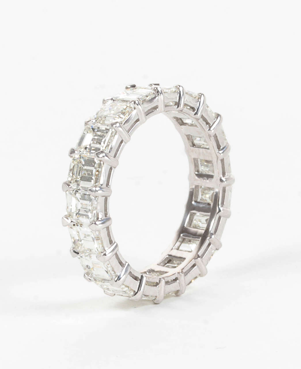 5.16 carats of G color Vs clarity emerald cut diamonds set in 18k white gold.

This ring along with all of our other eternity bands are custom made by us in New York.
