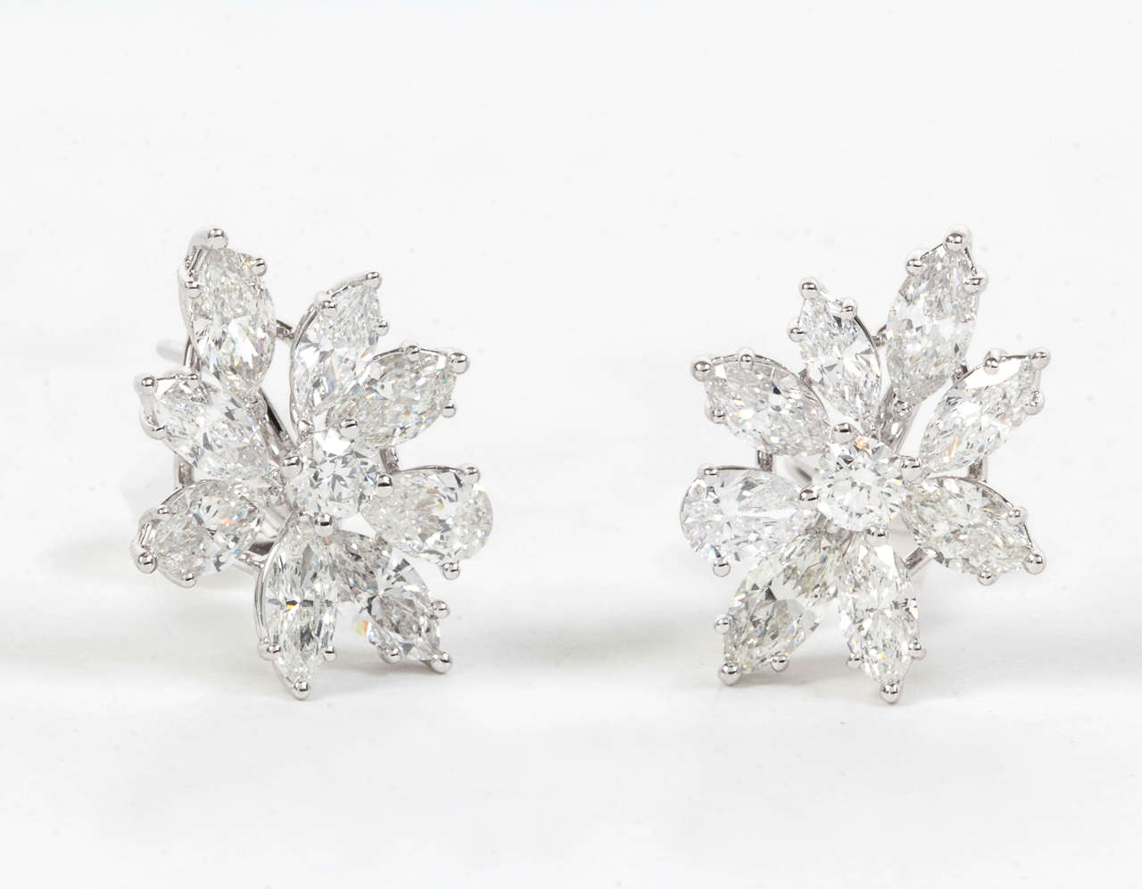 5.26 carats pear and marquise shaped diamonds set in 18k white gold.

Please email us for more information on this exquisite pair of earrings.