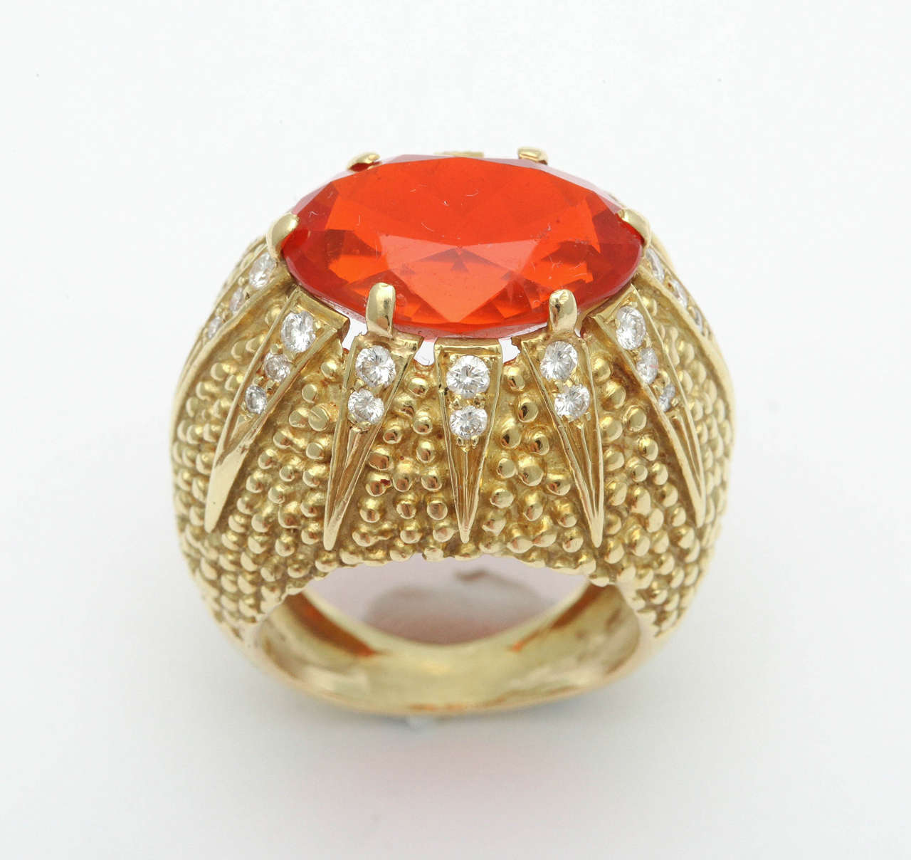 Leave it to the 50's.  Completely over the top.  Intense Fire Opal prong set in 18kt Yellow Gold Textured Mounting surrounded and set with 12 Diamond set Rays.  Size 7- 7 1/2. Signed Emis & stamped 18kt.