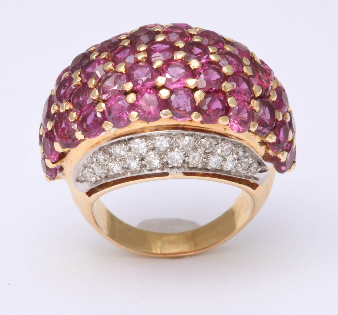 18Kt Yellow Gold Dome Ring.  Center set with faceted Rubies, prong set with sides , pave set, with full cut Diamonds. Approximately 2 cts of Diamonds & 5cts of Rubies.  Very chic & high style. Set in Rose Gold & Platinum.  The perfect Pinky Ring.