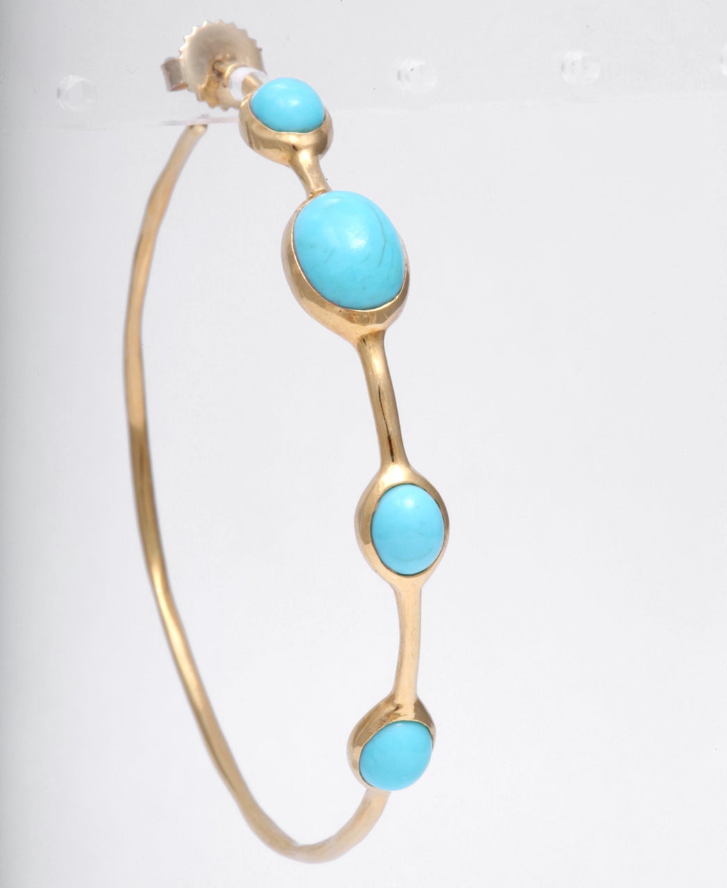 Signed Ippolita, these turquoise earrings are crafted in 18k yellow gold. Great summer accessory!