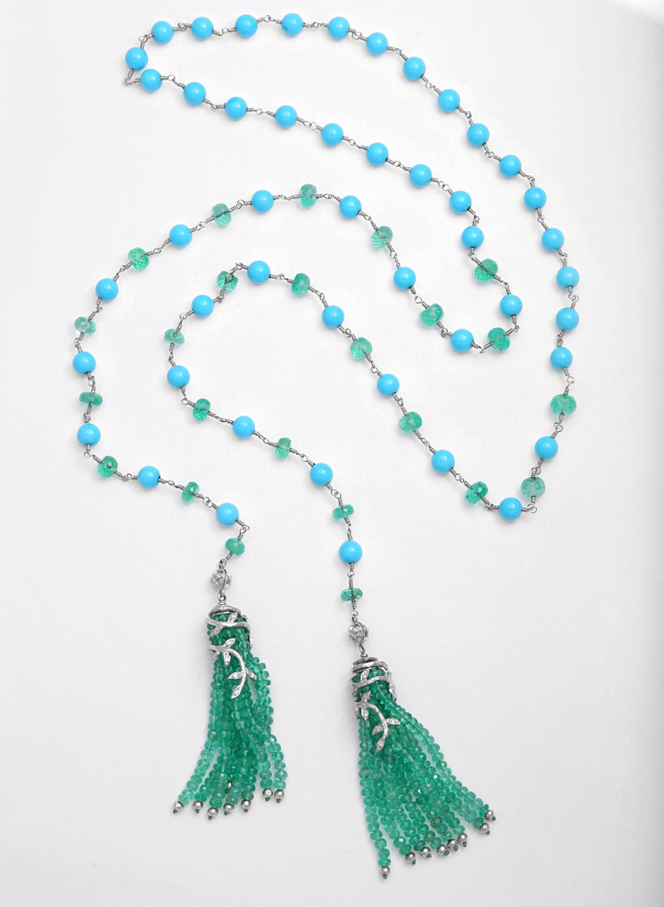 One of a kind Cathy Waterman tassel necklace featuring 24 green emeralds and 47 blue In her signature floral design, in platinum