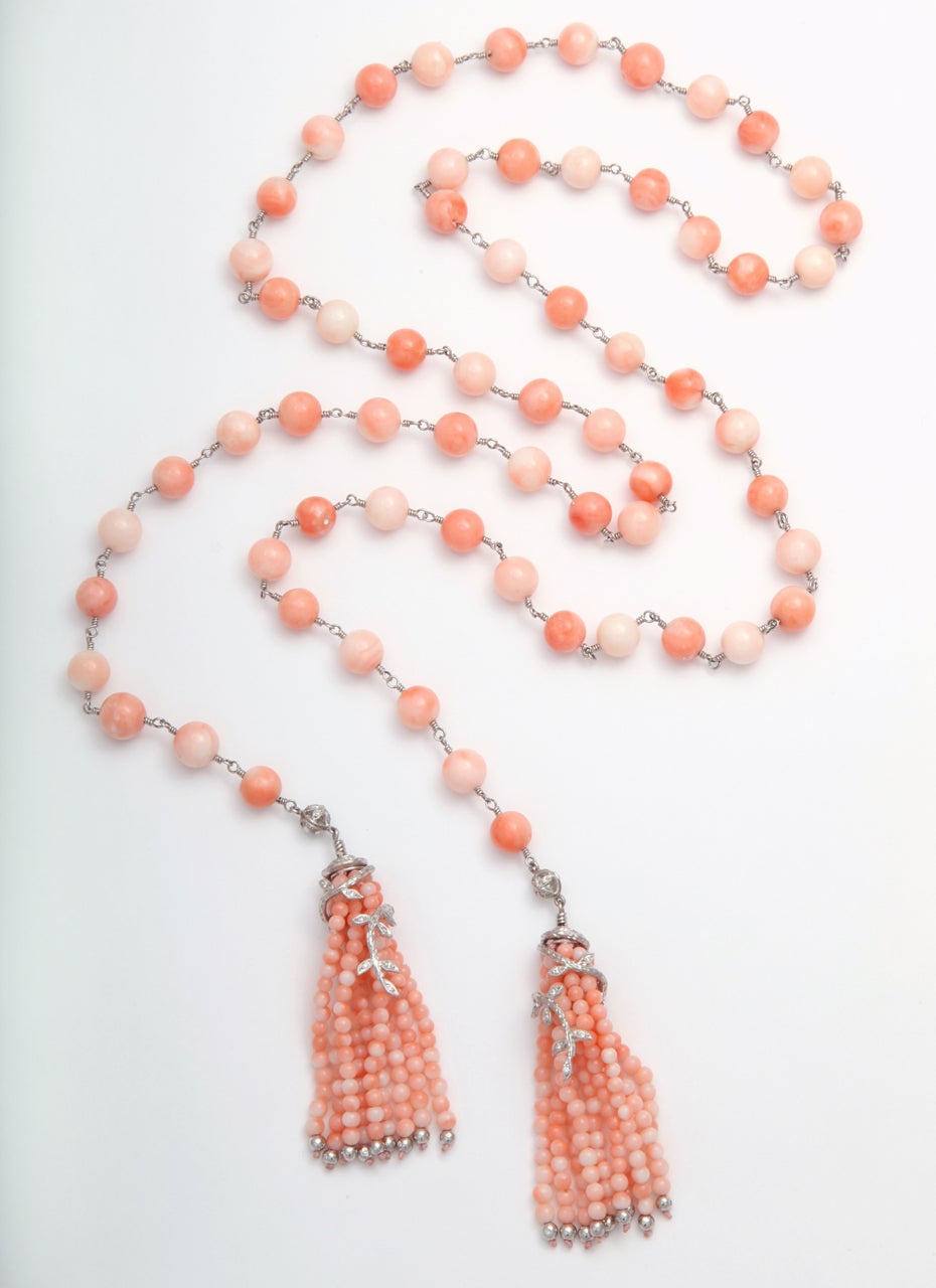 One of a kind Cathy Waterman tassel necklace featuring 39 round coral beads with touches of her signature floral diamond design, in platinum.