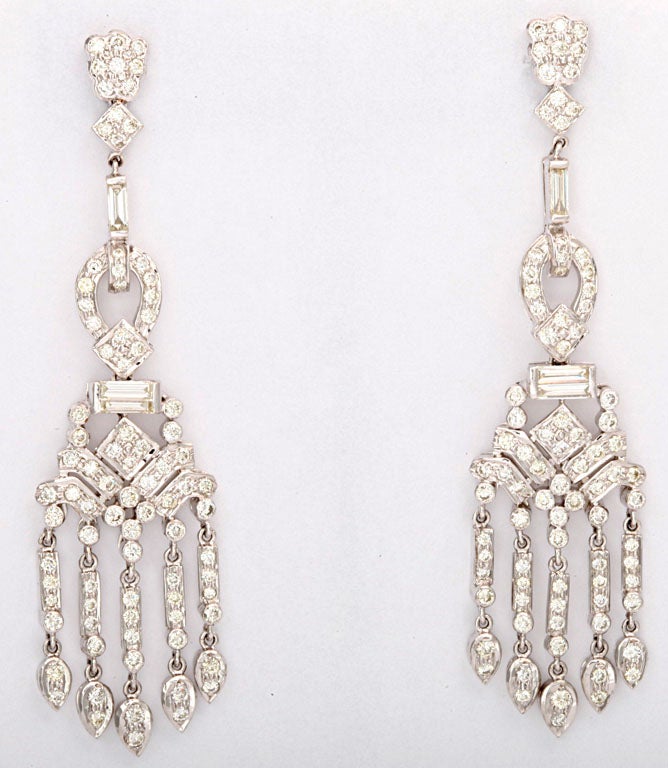 These delightful gems dance on the ear.  The earrings have 5.26 carats of diamonds set in 18k white gold.
