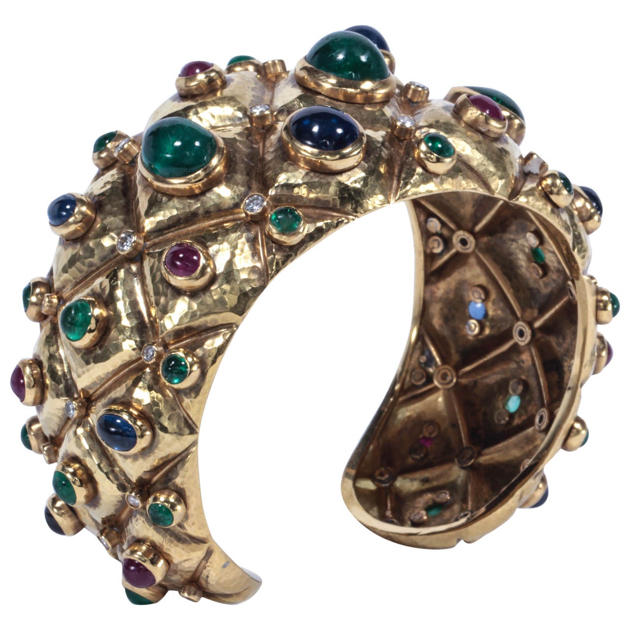 Hammered and decorated with cabochon Emeralds, Sapphires and Rubies and brilliant-cut diamonds.
