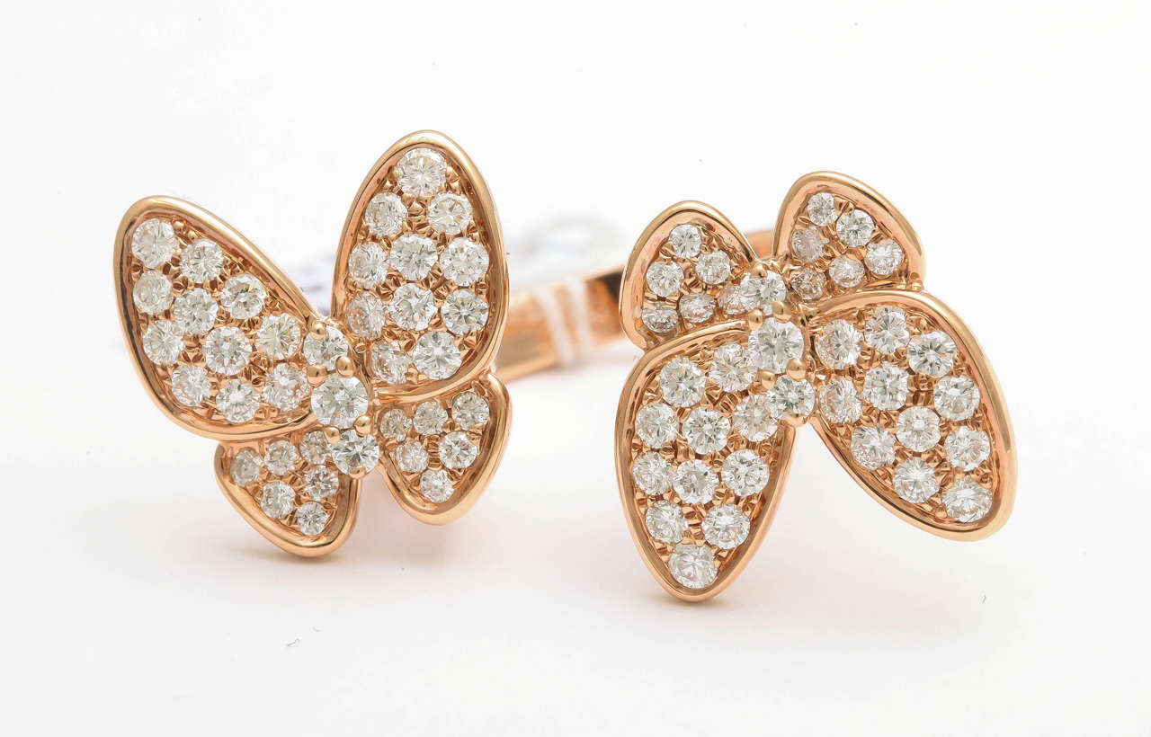 18k Rose gold ring featuring diamond butterflies, 1.78 carats.