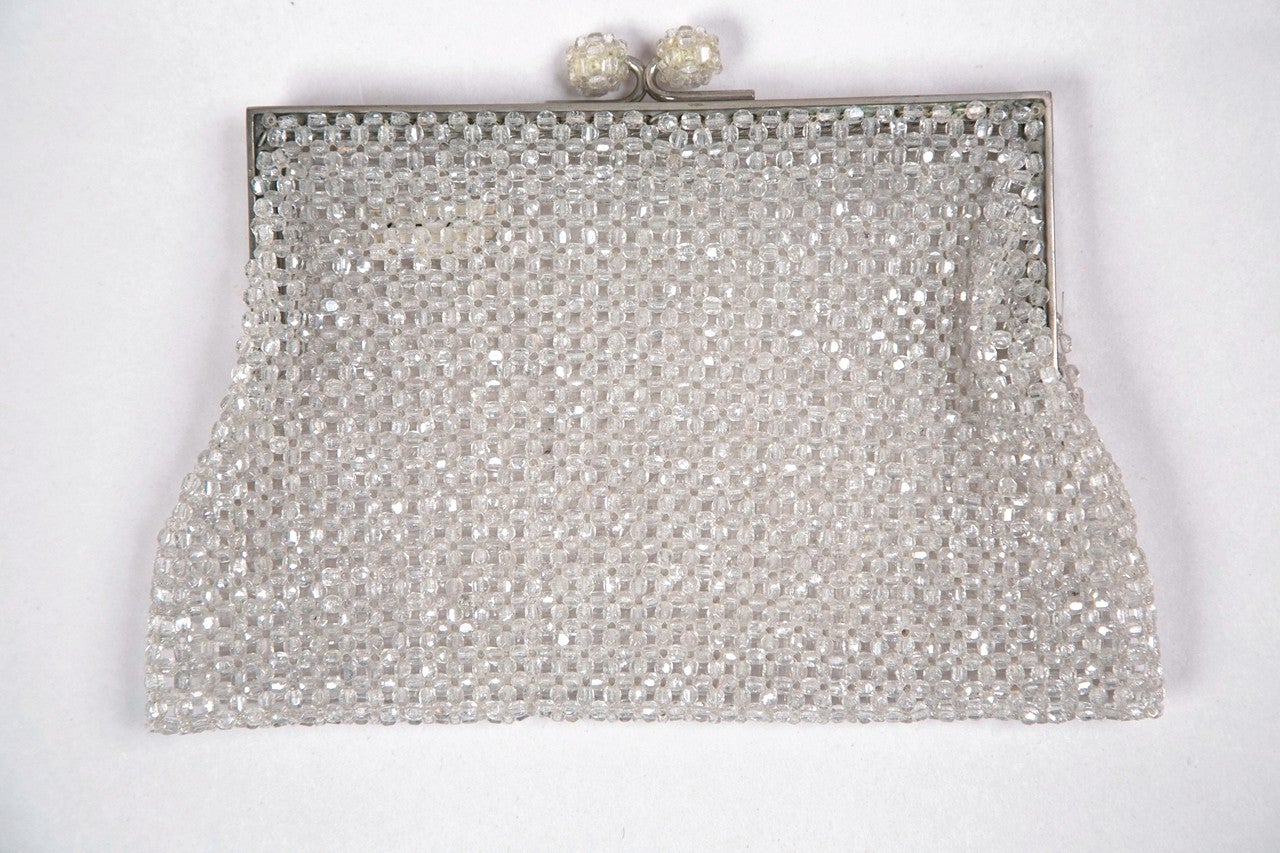 funkyfinders is premiering this italian coppola e toppo clutch. these designers were chosen by emilio pucci to create crystal details for pucci's apparel. the clear crystal surround is complimented with a coordinating crystal kiss lock closure. the