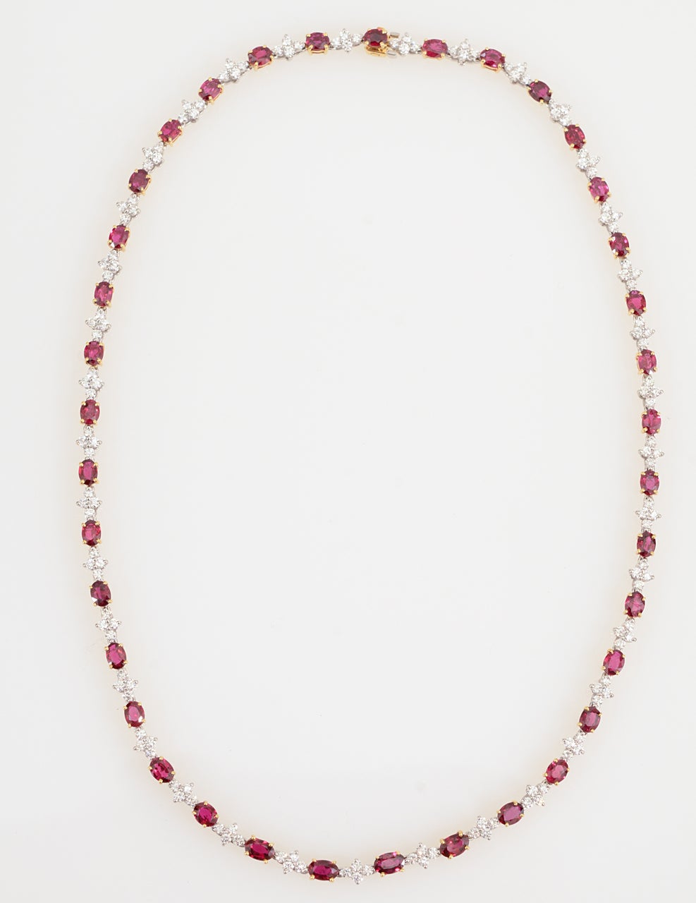 TIFFANY & CO. Ruby & Diamond Platinum Necklace.

Platinum & 18K Gold
37 Oval Ruby- approximately 20.50carats in rubies
148 Round Diamonds- Approximately 6 carats in diamonds.
