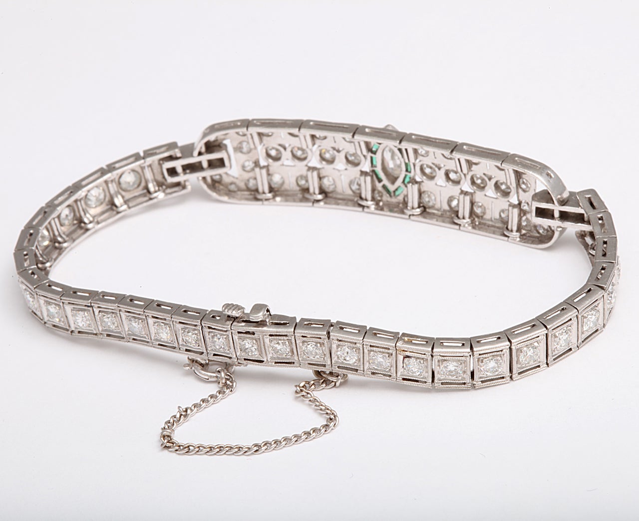 Platinum Diamond and Emerald Deco Bracelet at 1stdibs
