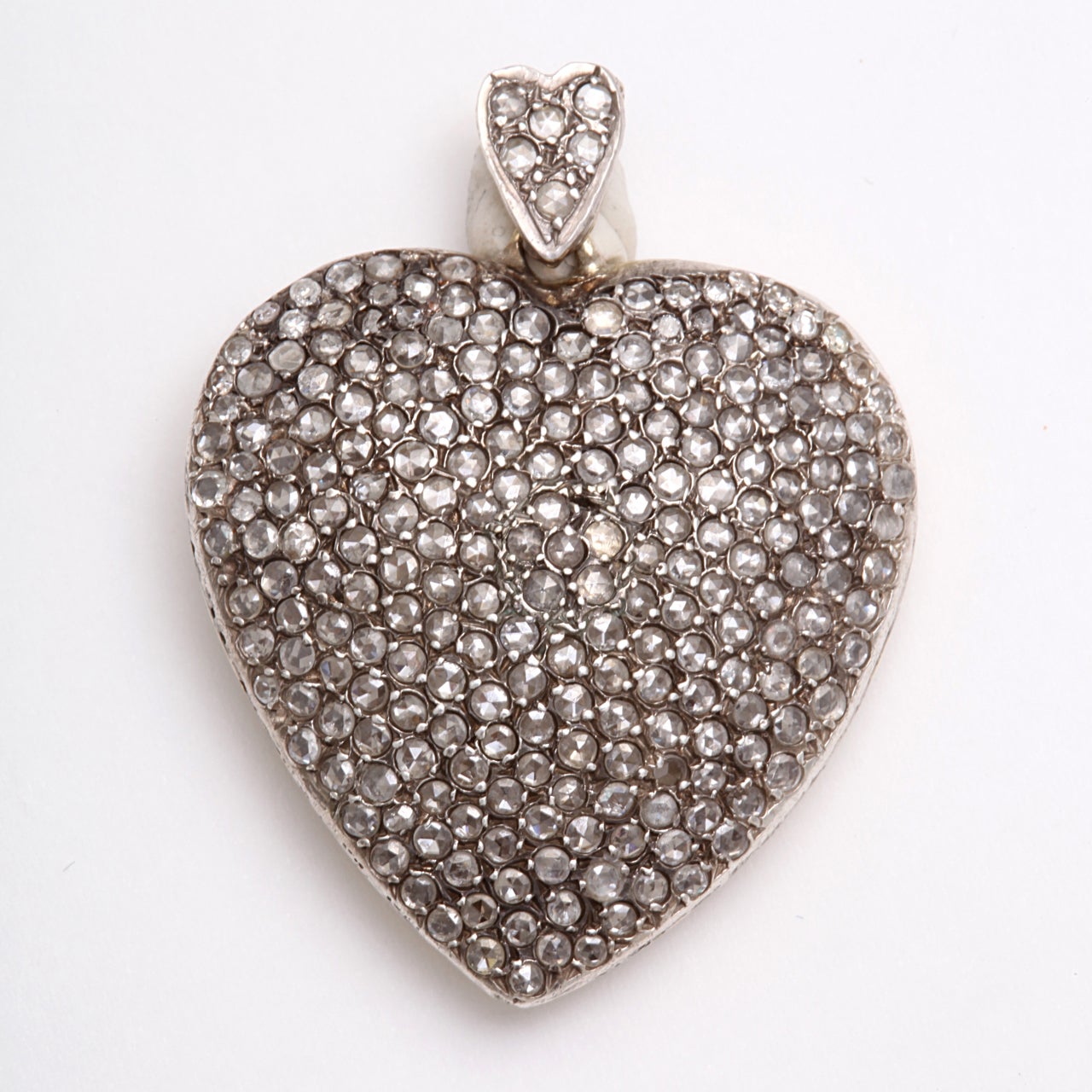 A stunning large antique diamond pendant set in 18 kt white gold