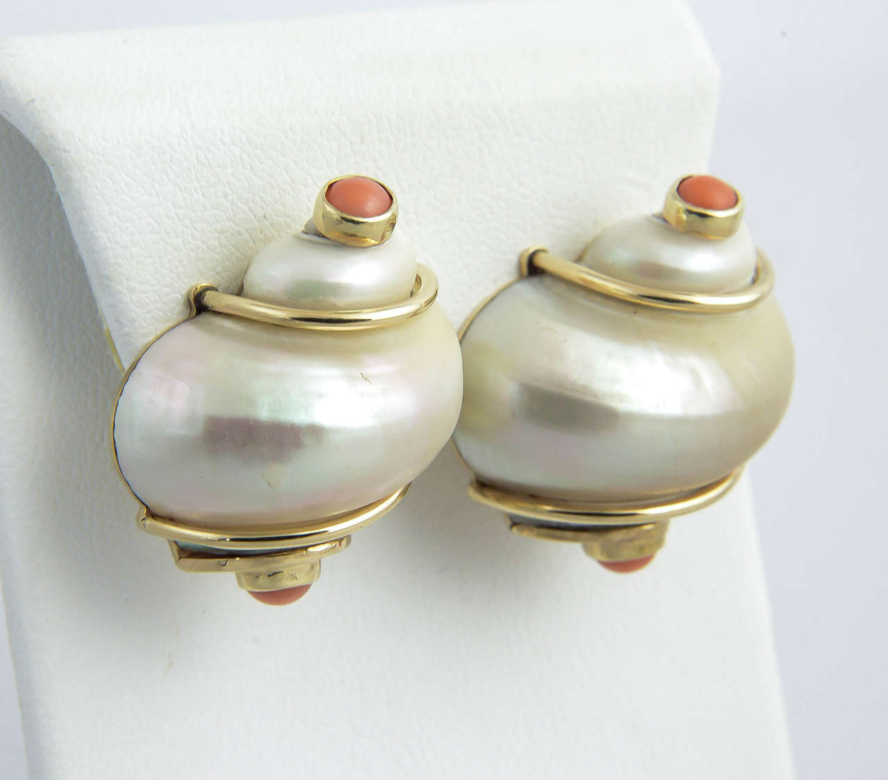 These are the classic Seaman Schepps Shell ear clips mounted in 14k yellow gold.