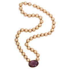 Hollow Bead Necklace with Bezel Set Amethyst Stone