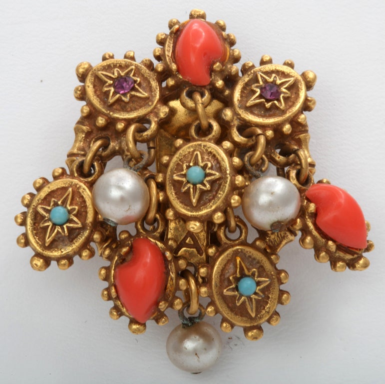 Intricate dangly earrings with faux coral, turquoise, and pearl stones.