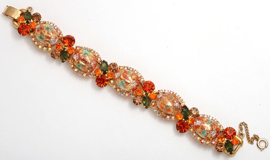 Julianna bracelet with oval art glass cabochons and rhinestones in oranges and greens.