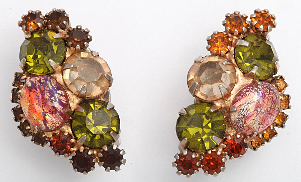 Rhinestone cluster earrings of greens and oranges.