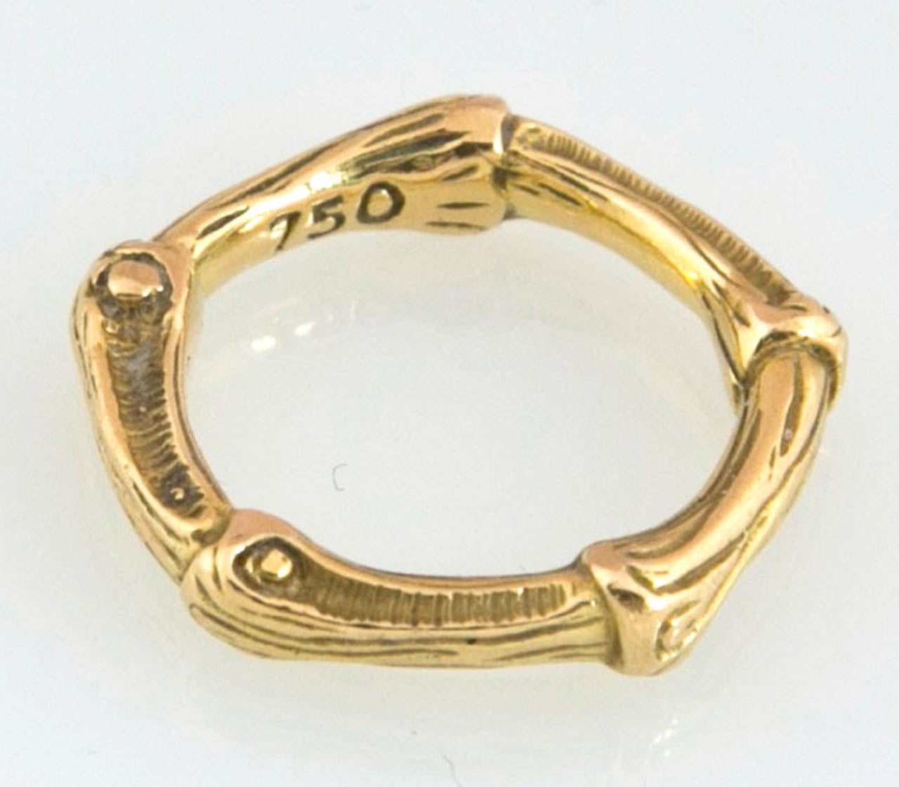 Made in 1960 by Tiffany & Co., this vintage ring is cast in a bamboo style. Marked 750, which is 18kt gold. Comes with original box. Size is 7 1/2.