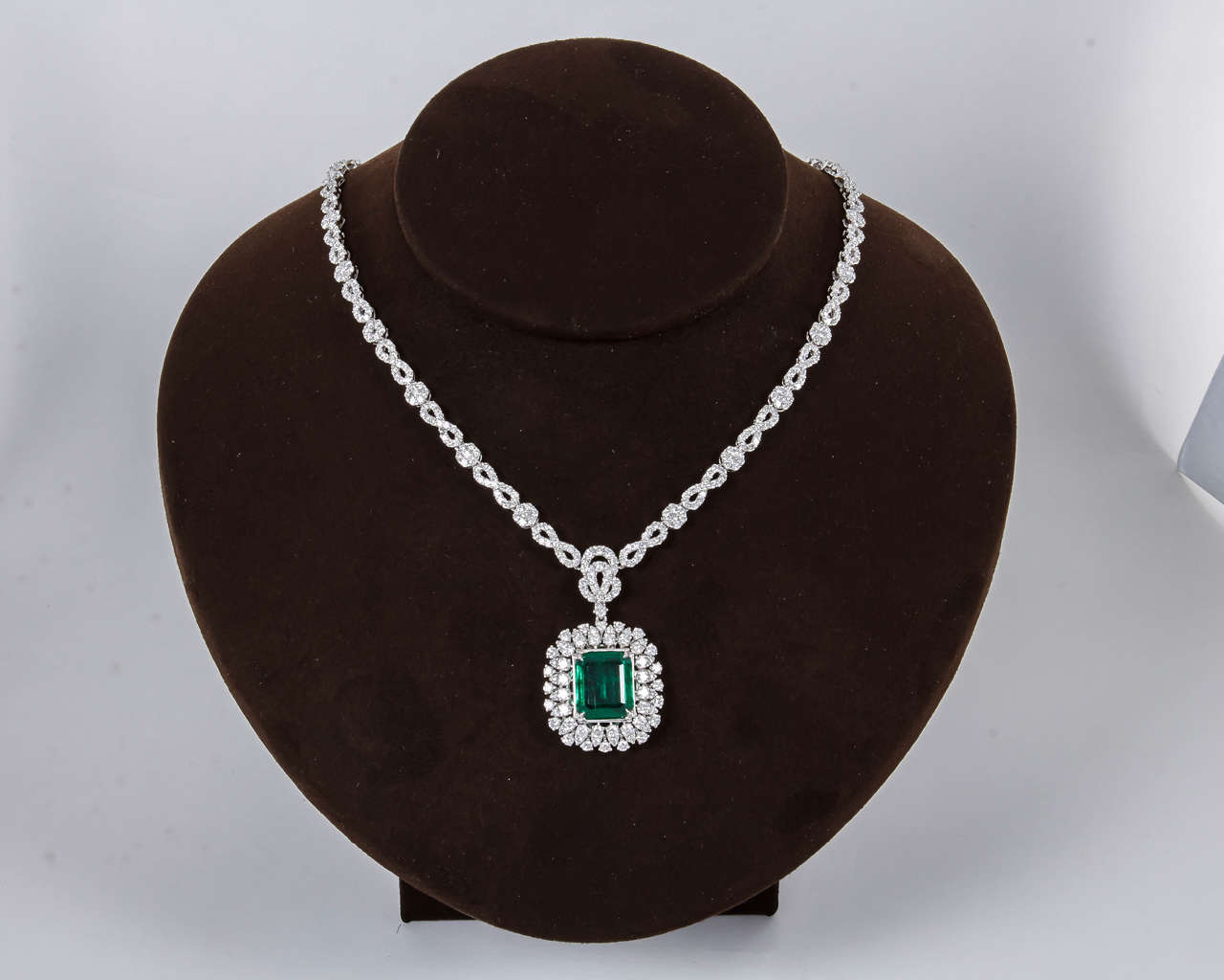 A beautiful wearable piece.

5.95 carat fine emerald cut Green Emerald.

10.30 carats of diamonds.

18k white gold.