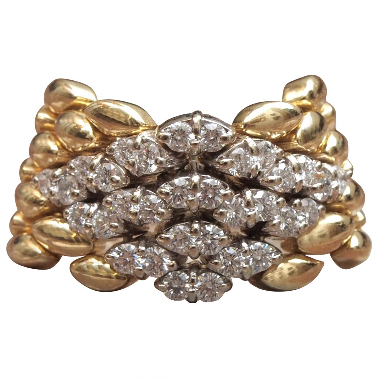 18kt Gold and 1.50 carats Diamonds. Flexible band.