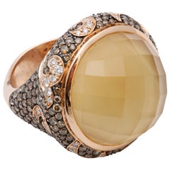 A diamond and citrine dress ring
