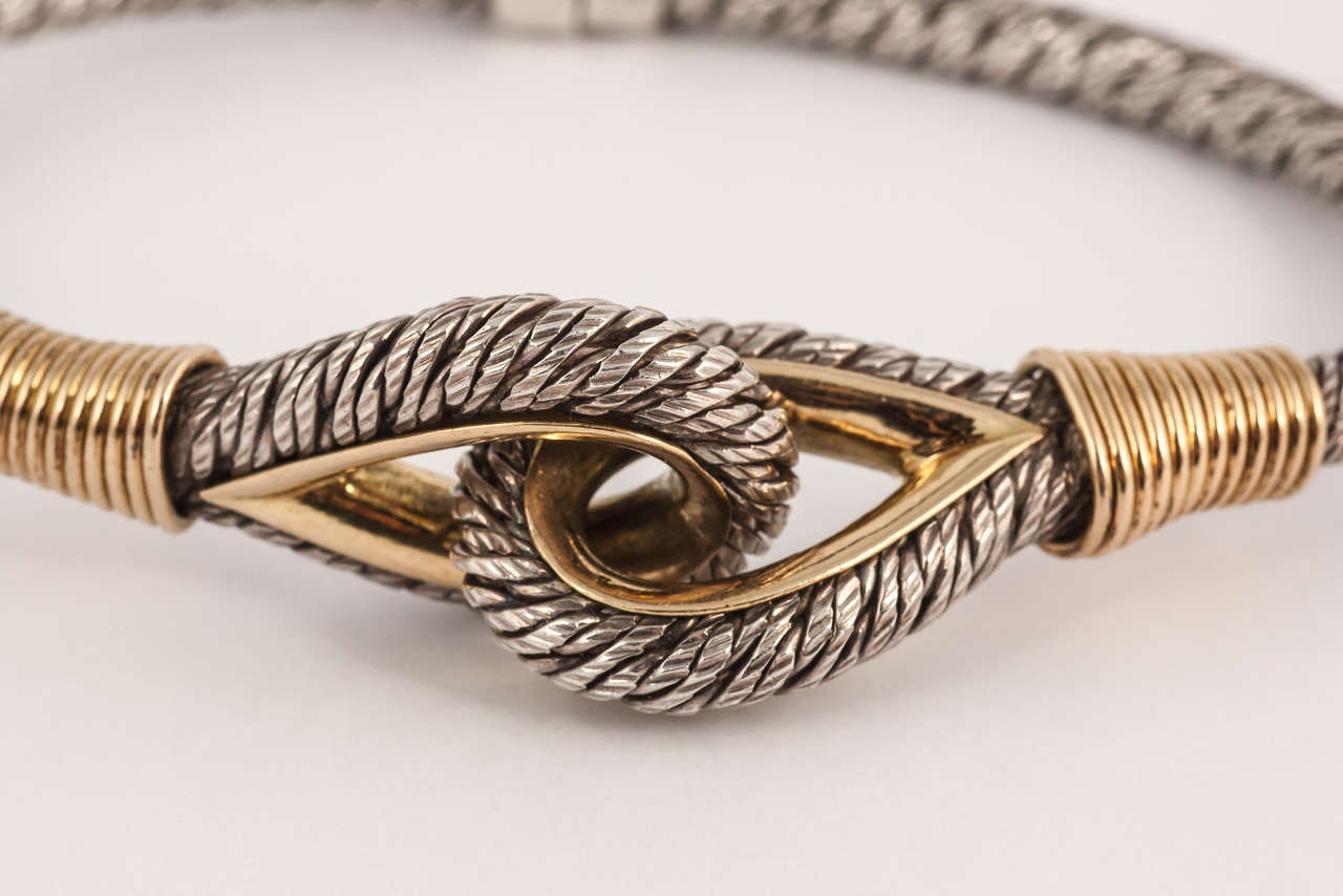 George Lafon designed this stylish silver rope twist bangle with gold embellishments for Fred of Paris.
