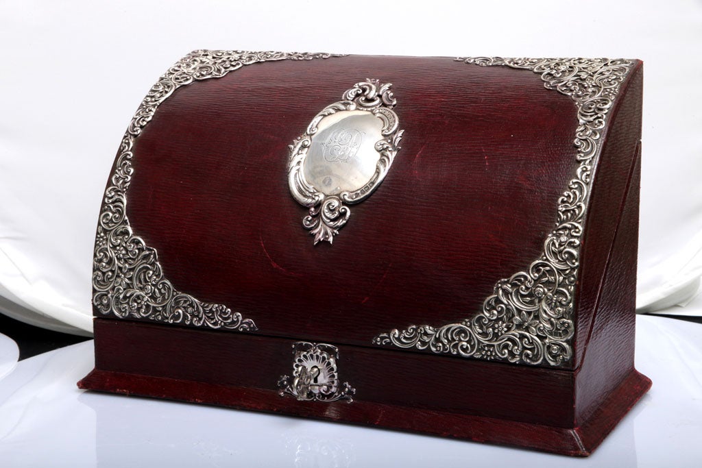 Sterling silver-mounted, oxblood-colored leather letter/stationery box, London, 1910, William Comyns - maker; moire silk lining is red in color (having an ink stain on the lower right corner of the "pen/pencil" holder (commensurate with