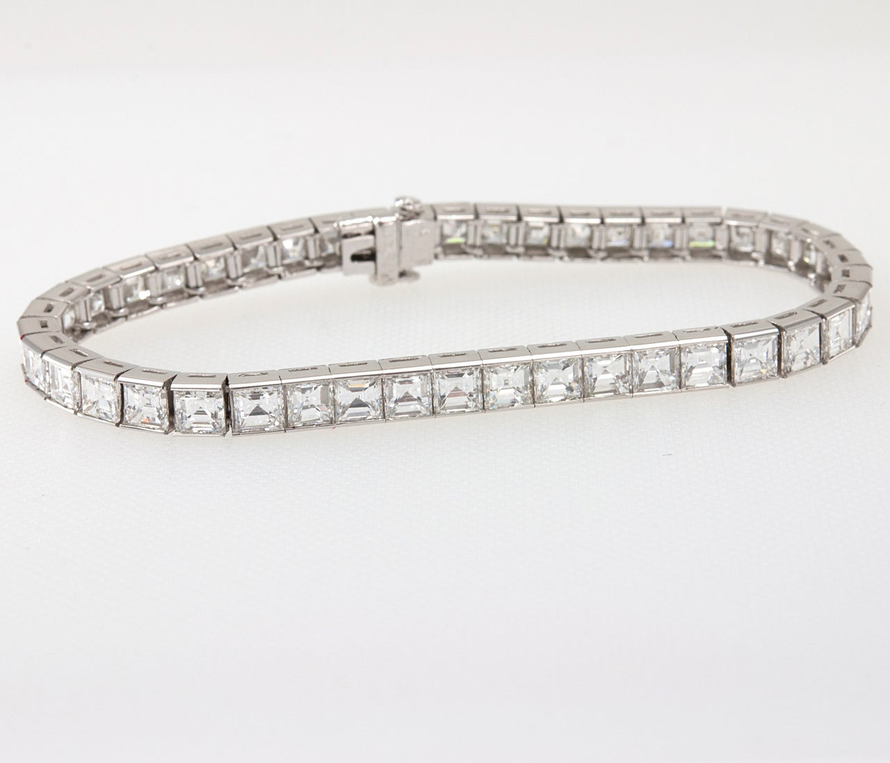 Beautiful square baguette diamond line bracelet. Set with approximately 16cts VS, G color diamonds. 7