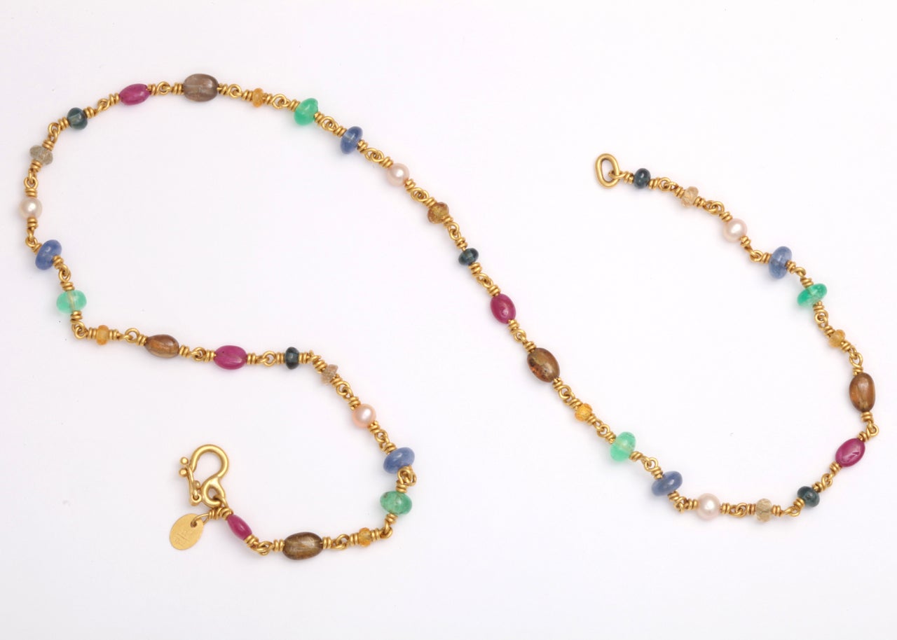 Dainty Reinstein Ross multi color sapphire necklace with touches of pearls, crafted in 22k yellow gold. Signed RR