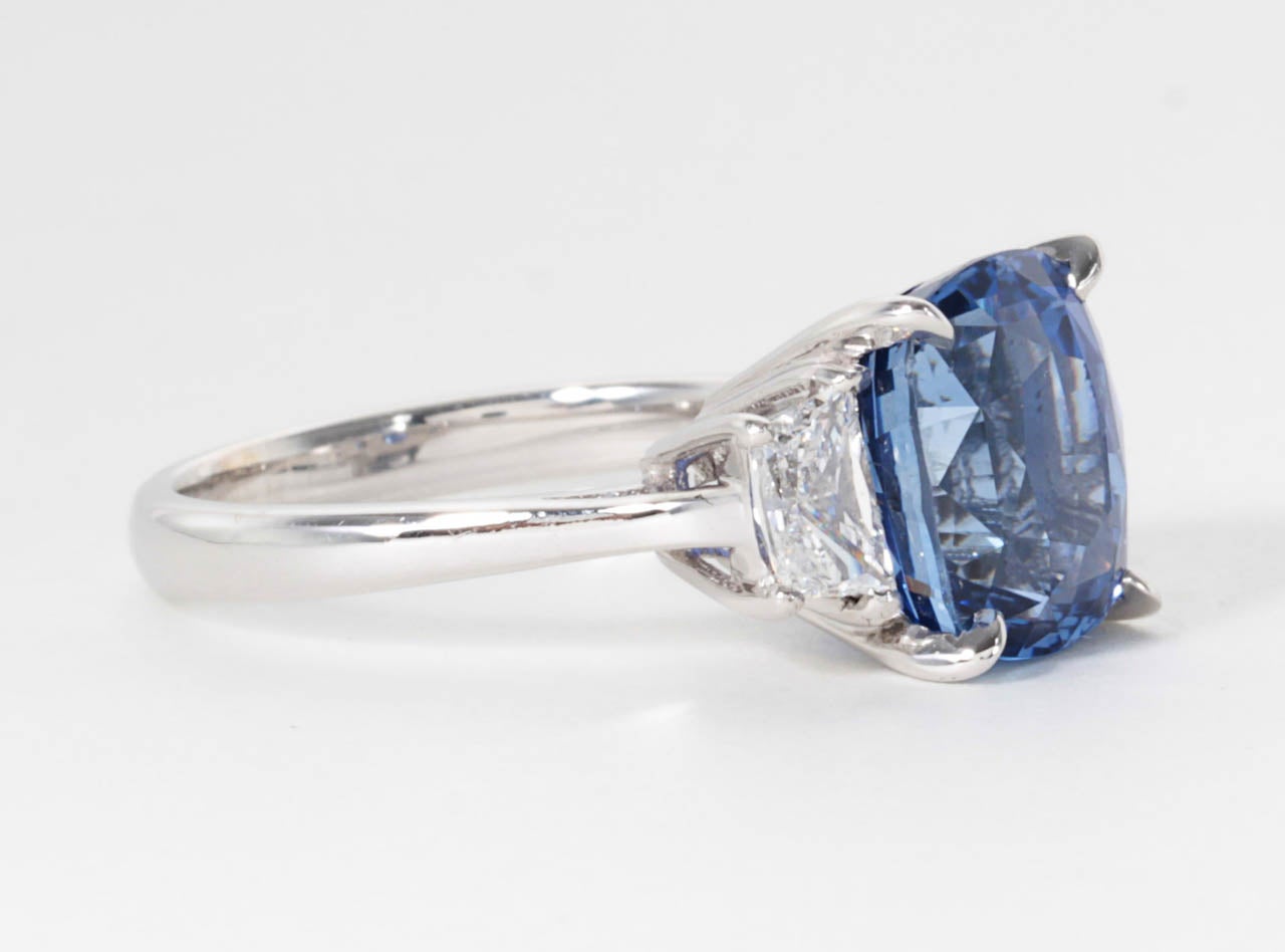 A gorgeous and very brilliant center sapphire! 

8.04 carats Cushion Modified Brilliant natural blue sapphire with minimal heat certified by GIA. 

This center sapphire is set in a 18k white gold custom handmade mounting set with trapezoid