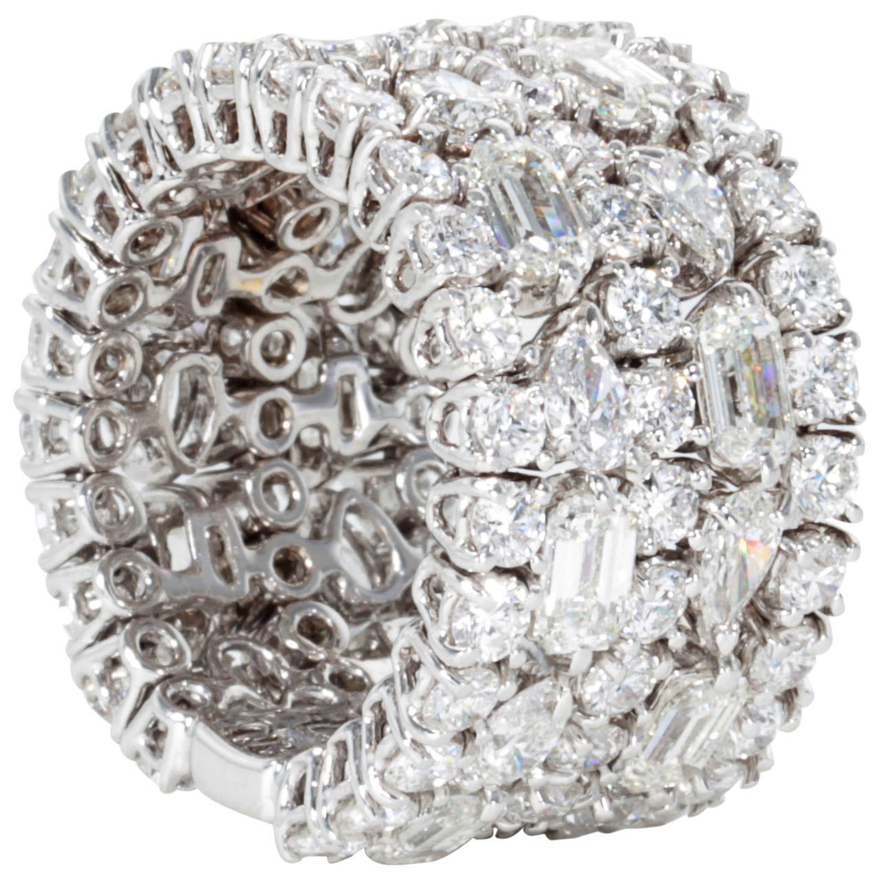 
A beautiful wide band to add to any collection with room for sizing.

8.80 carats of Emerald, Pear, and Round cut diamonds set in 18k white gold.

F color VS clarity diamonds.

14mm wide 

Made in Italy