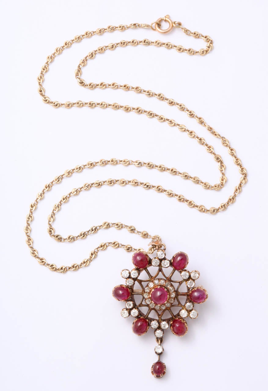 Victorian Cabochon Ruby & Old Mine Diamond Pendant Brooch. Set in 14kt Yellow Gold  and suspended from a more modern filigree chain. Very sumptuous.