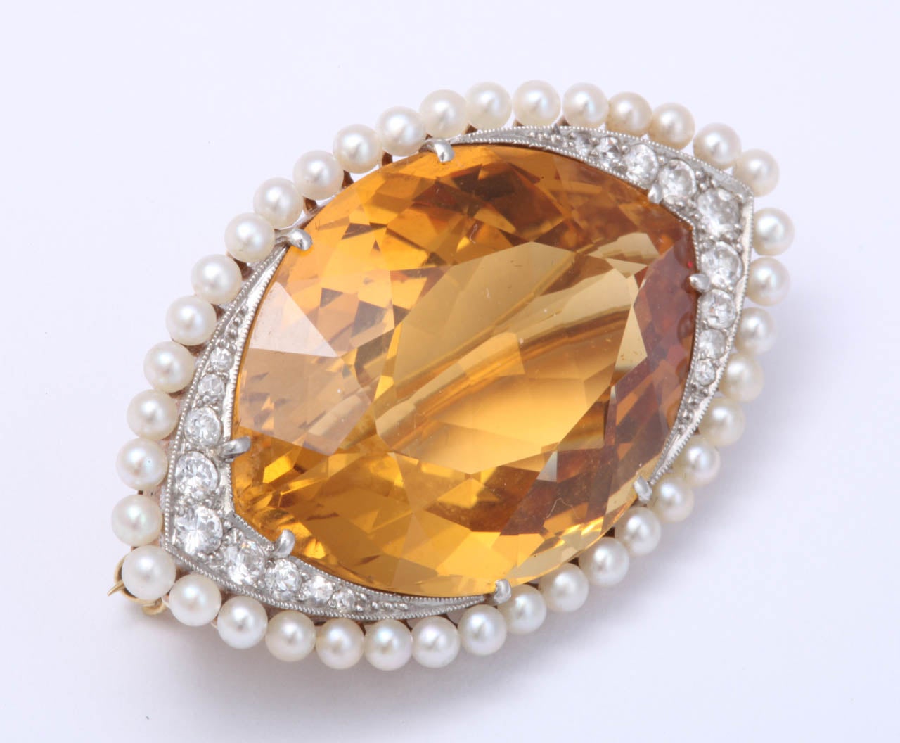 Ovoid shaped &  Platinum Topped Faceted Citrine & Natural Pearl & Diamond Brooch.  Edwardian - Ca 1910. 18kt Yellow gold back.  Intense yellow-orange color of the Citrine offset by the delicacy of the Natural, prong set Pearls  & the sharpness &