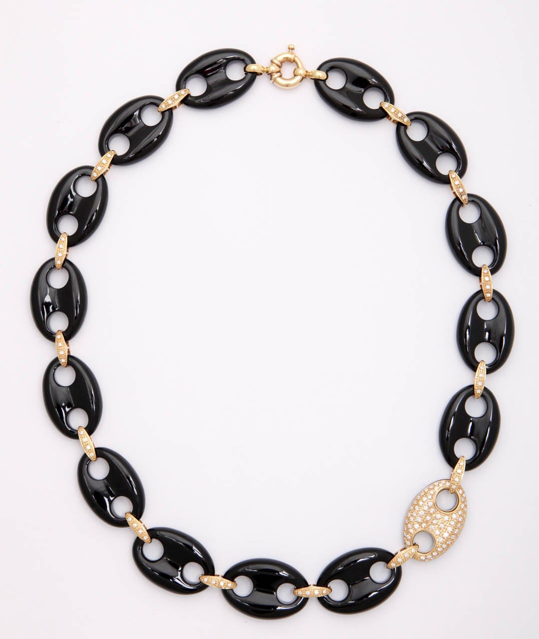 Updated version of the Anchor Chain.  Carved Black Onyx sections connected by 18kt Yellow Gold & Pave Diamond connectors  with one random 18kt Yellow Gold & Pave Diamond Element falling to the front.  Clasped with a single Gold