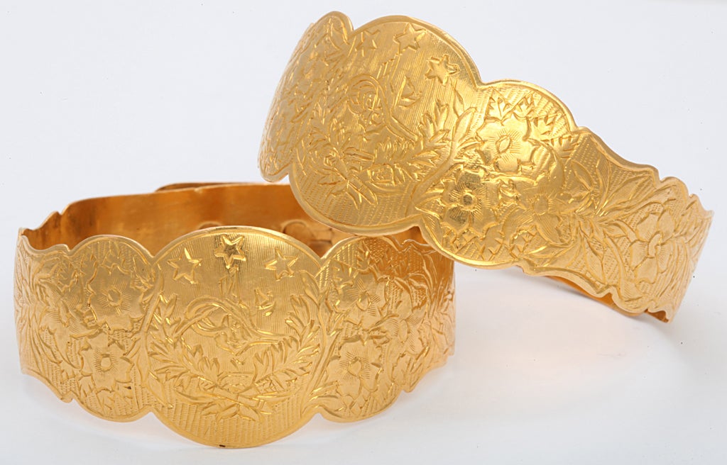 Pair of matching hand made & engraved 22kt Yellow Gold  Cuffs with adjustable closing.
 Bracelets are hand chased with floral panels  & bear the Mark of the Ottoman Empire. They have a Rococo Border.