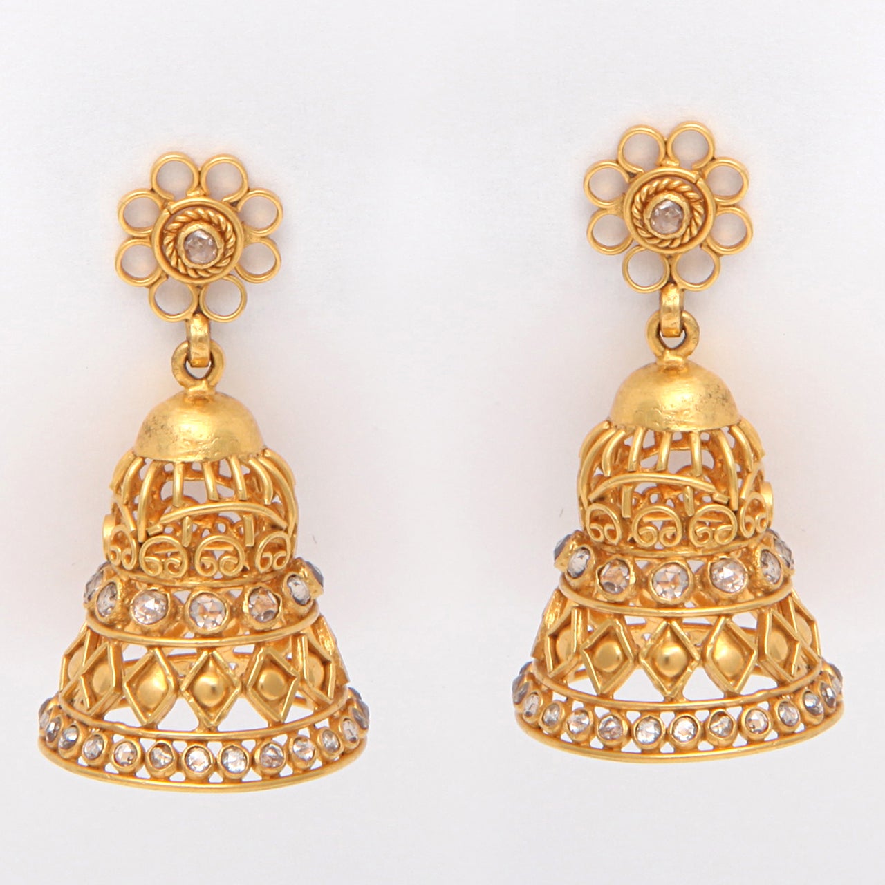 A pair of 18kt yellow gold and diamond bell earrings. The earrings are suspended from 18kt yellow gold and diamond flower studs. There are approximately 2.09cts of diamonds.