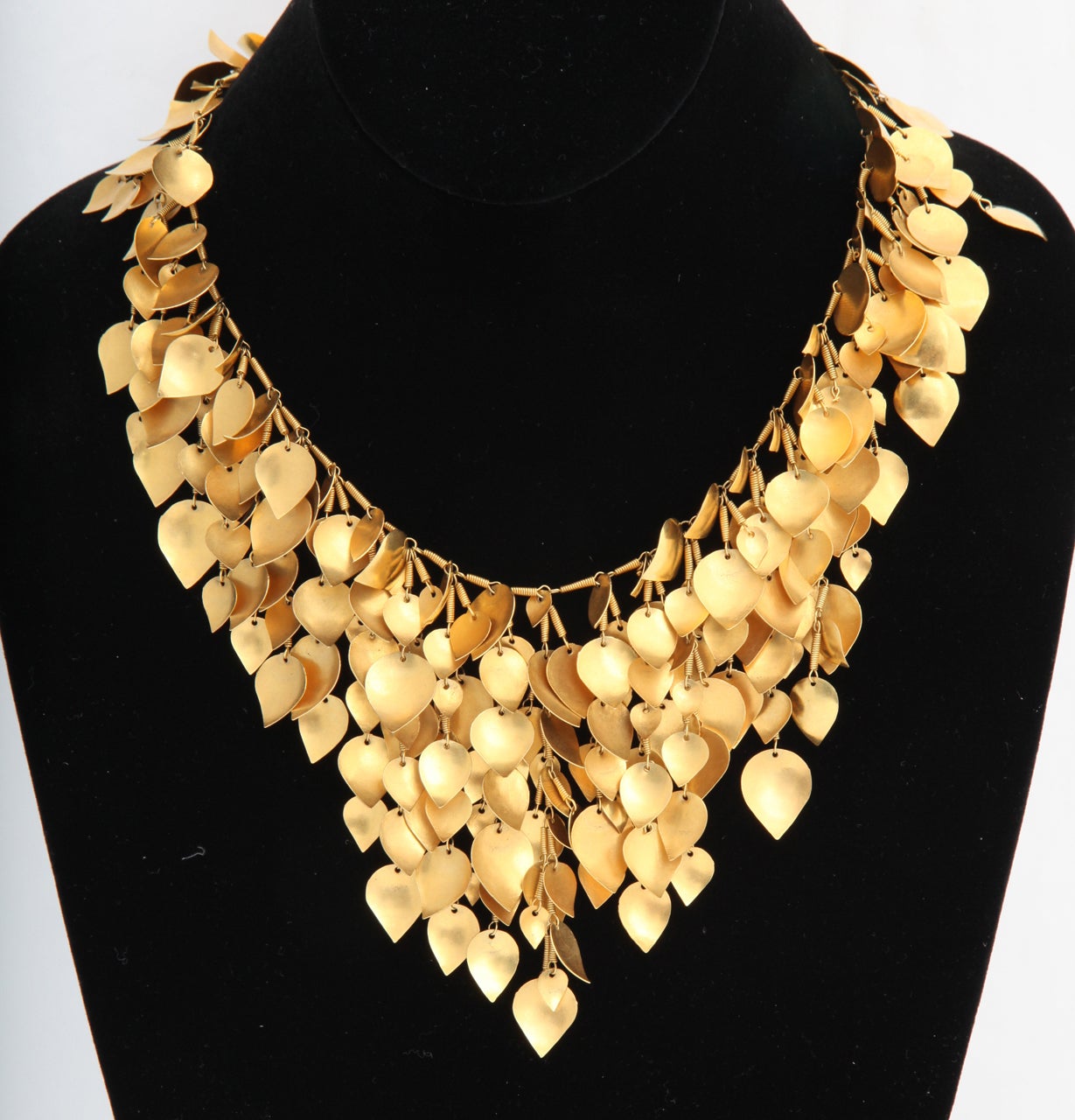 A 22kt yellow gold necklace composed of handmade 22kt yellow gold leaves and a handmade 18kt yellow gold chain.