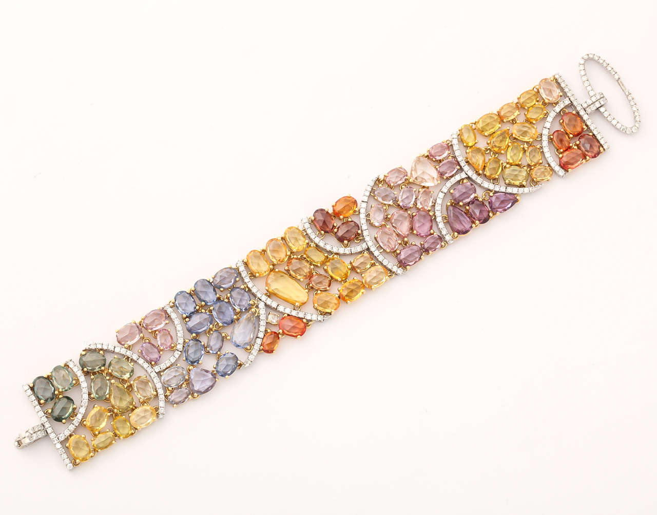 82 green, orange, yellow, pink and blue sapphires approximately 60 carats
237 diamonds approximately 3.00 carats
18k yellow gold