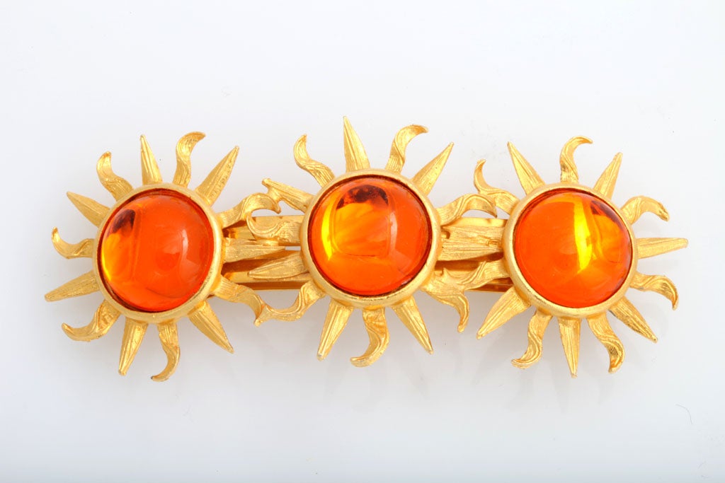 Large, stunning hair clip decorated with three orange cabochon suns.